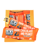 box of dark chocolate peanut bars with bars sticking out, one is partially unwrapped